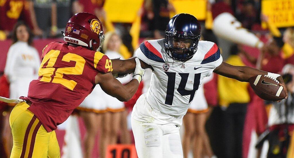 USC linebacker Uchenna Nwosu pressures Arizona quarterback Khalil Tate during the first half of a game at the Coliseum.