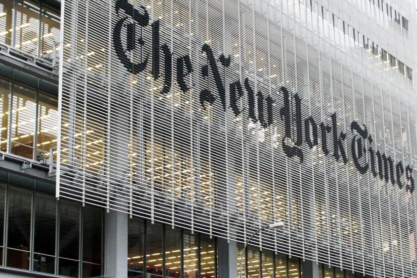FILE - This Wednesday, Oct. 10, 2012, file photo shows the New York Times building in New York. On Wednesday, Jan. 14, 2015, The New York Times Co. reports earnings Wednesday, Nov. 1, 2017. (AP Photo/Richard Drew, File)