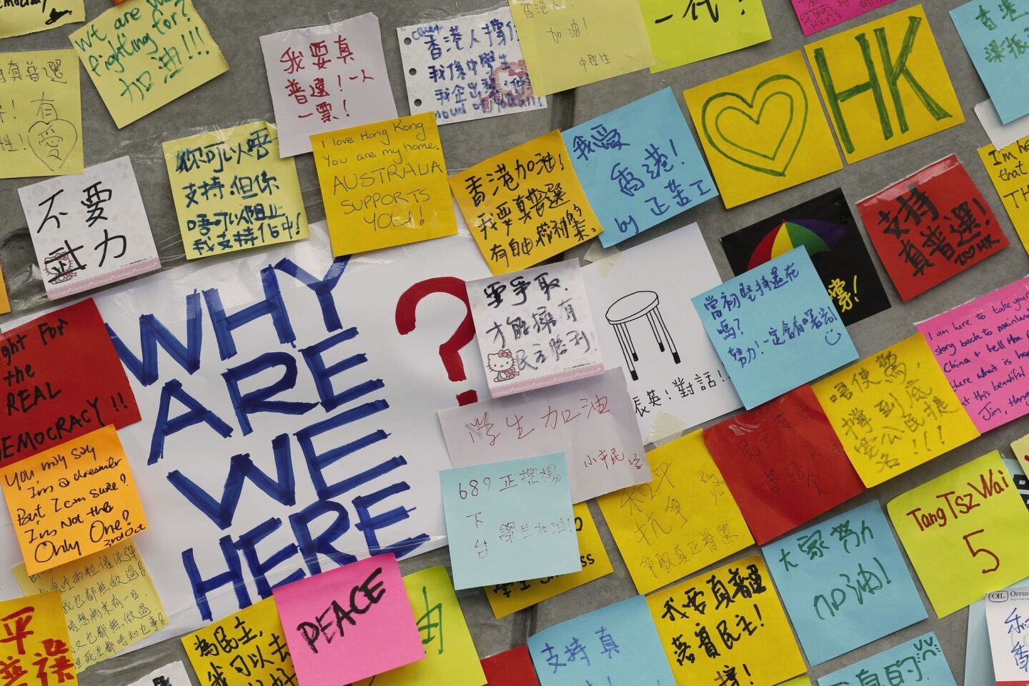 Notes of support are posted on the wall of an encampment of pro-democracy student protesters outside the government complex in Hong Kong.