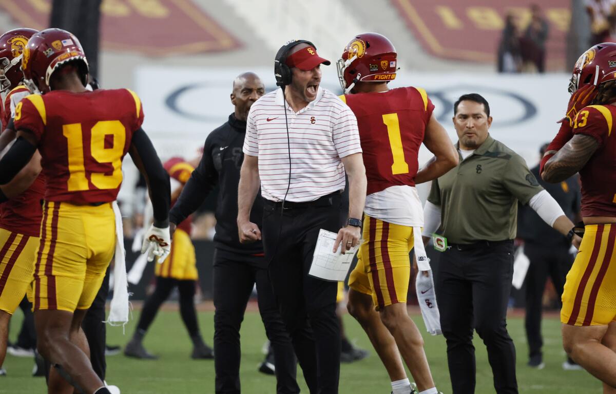 USC defensive coordinator Alex Grinch yells at the defense after it gave up a Washington touchdown at the Coliseum.