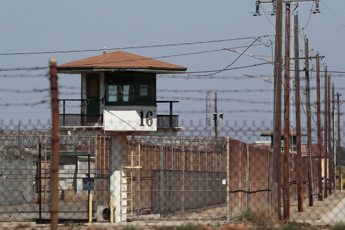 An exterior of a double-fenced area with an elevated guard port.