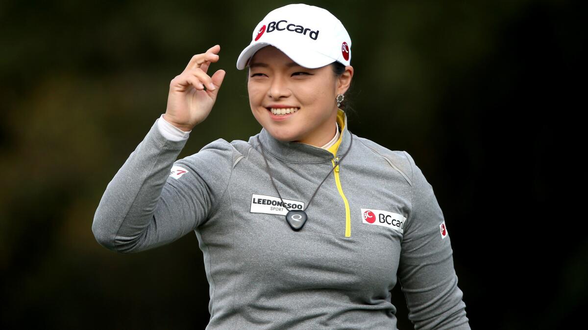 Ha Na Jang acknowledges the crowd on the 15th hole Saturday.