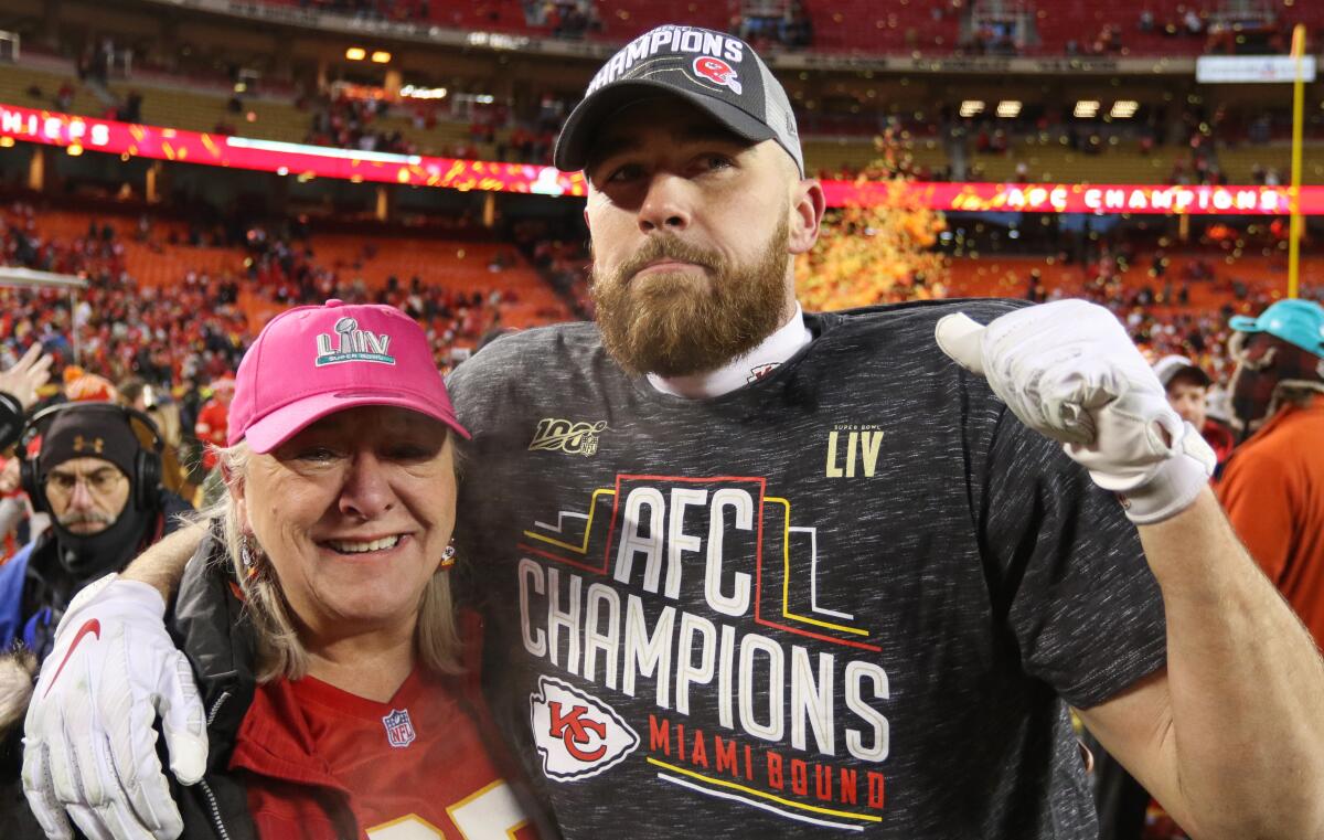 Kansas City Chiefs tight end Travis Kelce and his mother Donna celebrate the team's AFC championship victory.