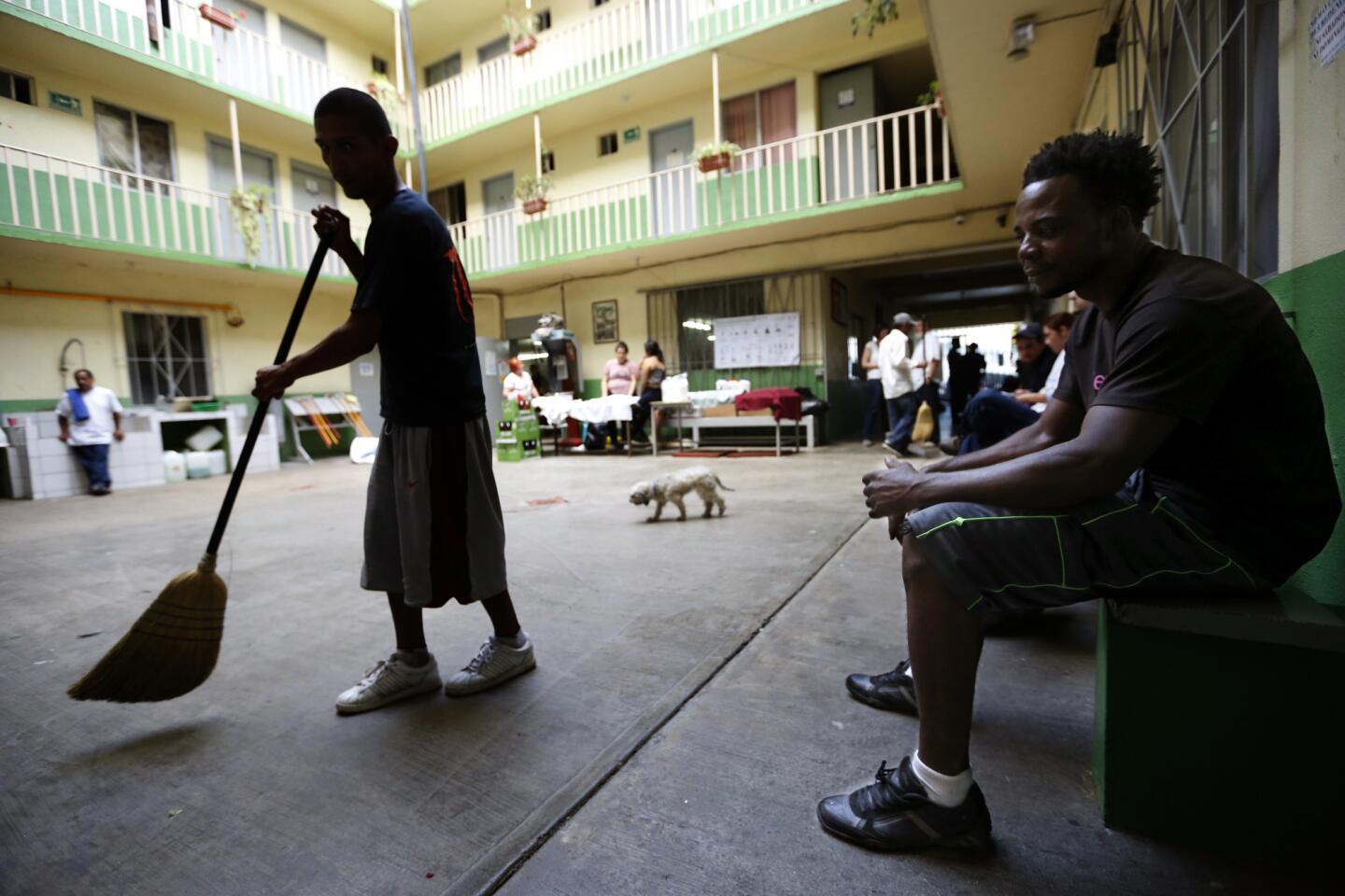 Emmanuel Philips, from Haiti, sits in the atrium at the Casa del Migrante shelter in Tijuana, Mexico.