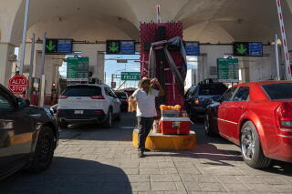 Motorists drive into Mexico at Paso del Norte International Bridge