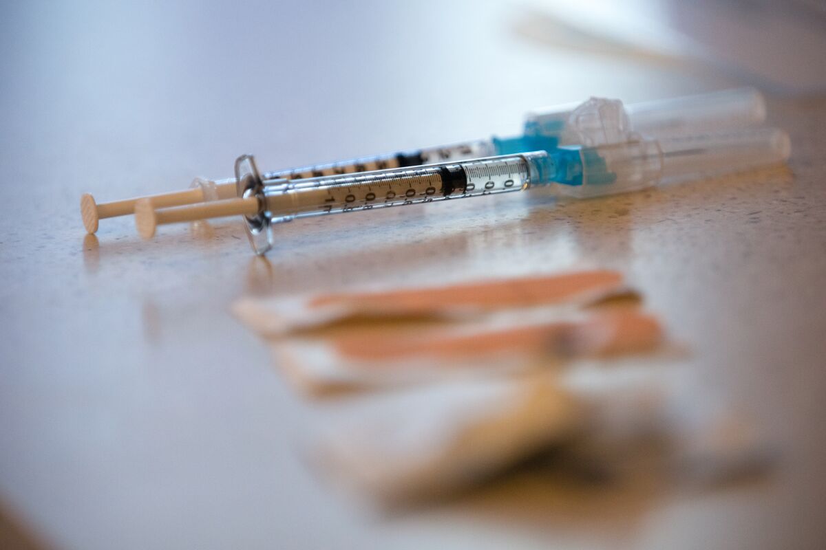 Syringes with the Pfizer vaccine against COVID-19.