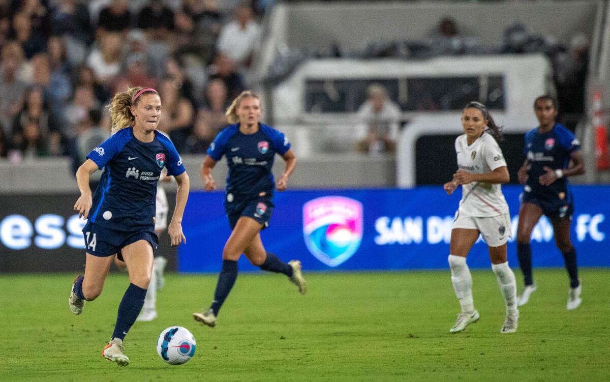 Wave Midfielder Kristen Mcnabb moves the ball upfield in Friday's game. The Wave tied the North Carolina Courage 0-0.