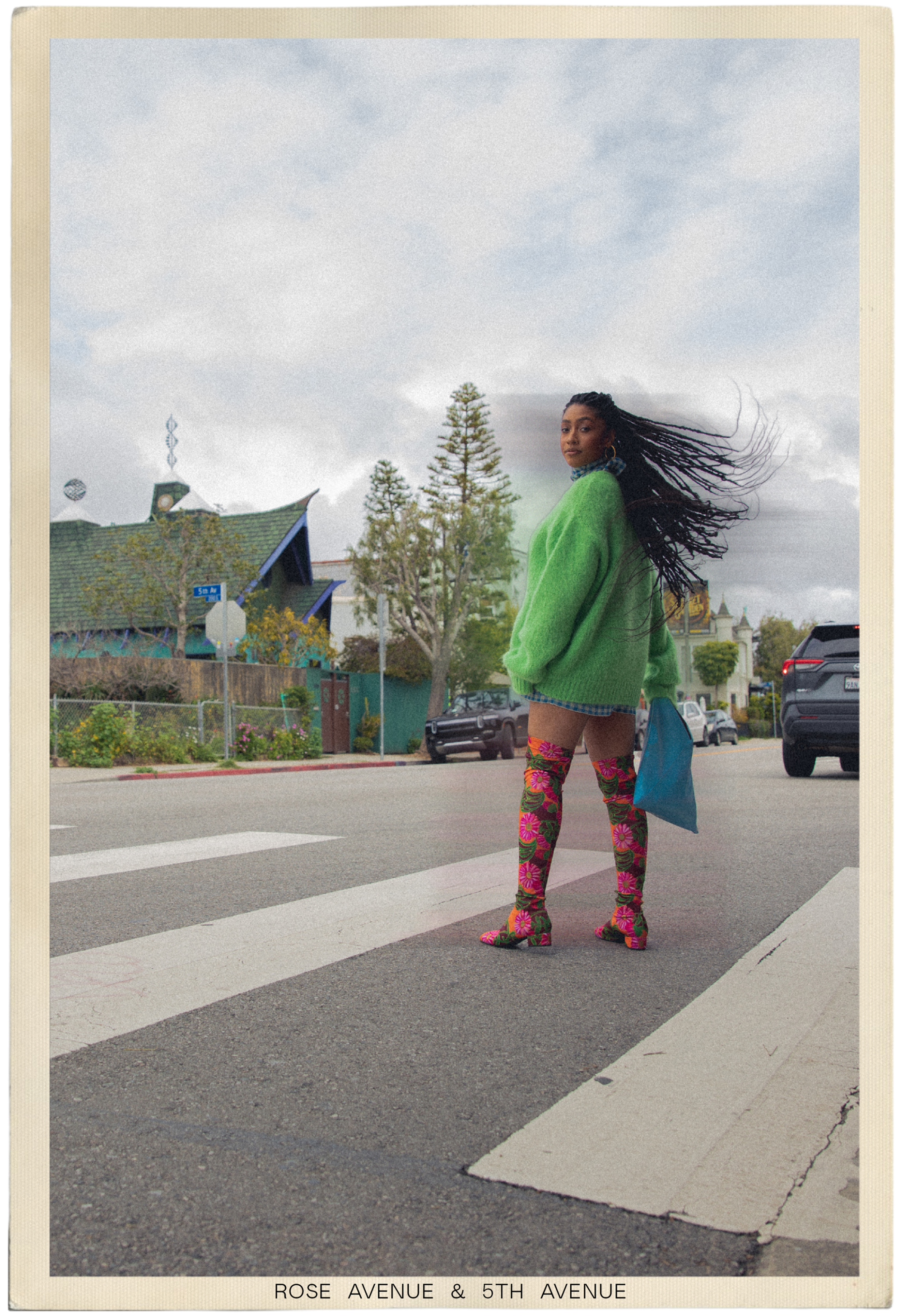 Samira Ibrahim on a crosswalk, her hair swept by the wind.