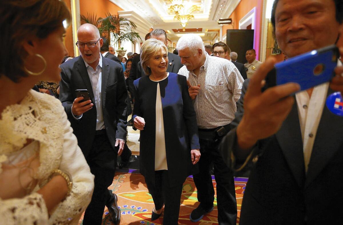 HIllary Rodham Clinton speaks with a supporter after the Democratic debate in Las Vegas. Her strong performance reassured anxious Democrats and solidified her place atop the party’s presidential field.