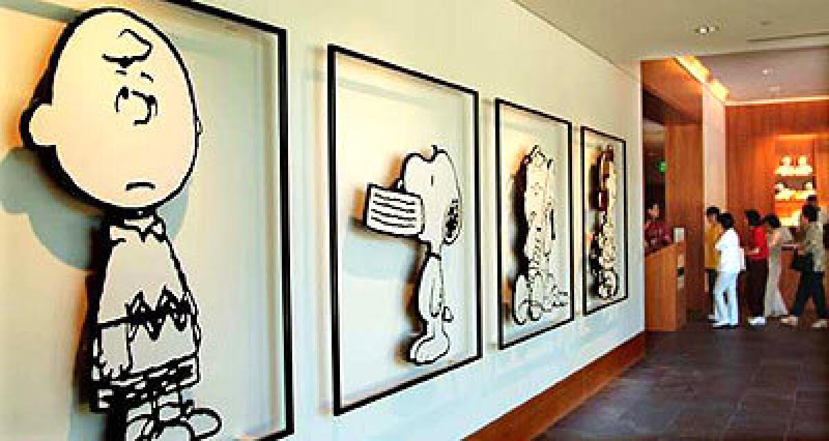 "Peanuts" characters line a wall at the entrance to the nostalgic Charles M. Schulz Museum in Santa Rosa.