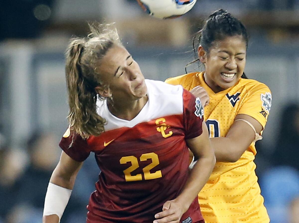 USC's Ashleigh Plumptre heads the ball in front of West Virginia's Carla Portillo during the 2016 NCAA Women's College Cup soccer final.