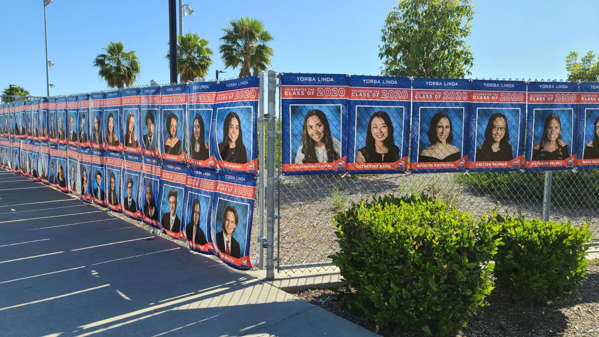 Yorba Linda High School put photos of their graduating seniors along their chain-link fences for all drivers-by to see.