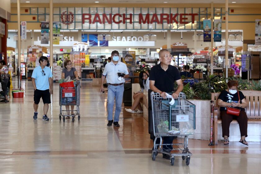 ROWLAND HEIGHTS, CA - JULY 11: Shoppers in the indoor mall at the 1000 block of North Nogales Avenue near the 99 Ranch market on Monday, July 11, 2022 in Rowland Heights, CA. A couple was pistol-whipped and robbed in a parking lot in a parking lot in the 1000 block of North Nogales Avenue near the 99 Ranch market in broad daylight, according to the Los Angeles County Sheriff's Department. Authorities said the two suspects pistol-whipped the victims on their heads and robbed one of the victims of a $60,000 Rolex. (Gary Coronado / Los Angeles Times)