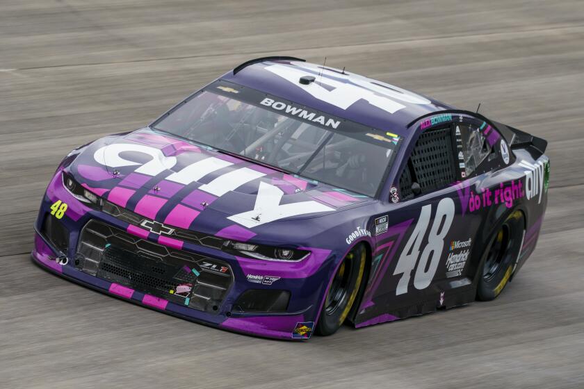 Alex Bowman races during a NASCAR Cup Series auto race at Dover International Speedway.