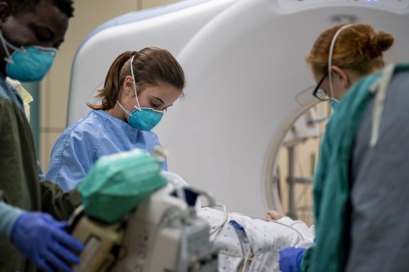 Hospitalman Aliah Kitsmiller, from Erie, Colo., prepares a patient for a computer tomography (CT) scan aboard the hospital ship USNS Mercy (T-AH 19) April 11. (U.S. Navy photo by Mass Communication Specialist 2nd Class Ryan M. Breeden)