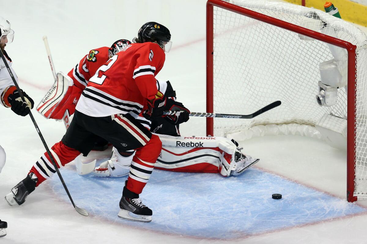 Blackhawks defenseman Duncan Keith sweeps the puck off the goal line in the third period of Game 6.