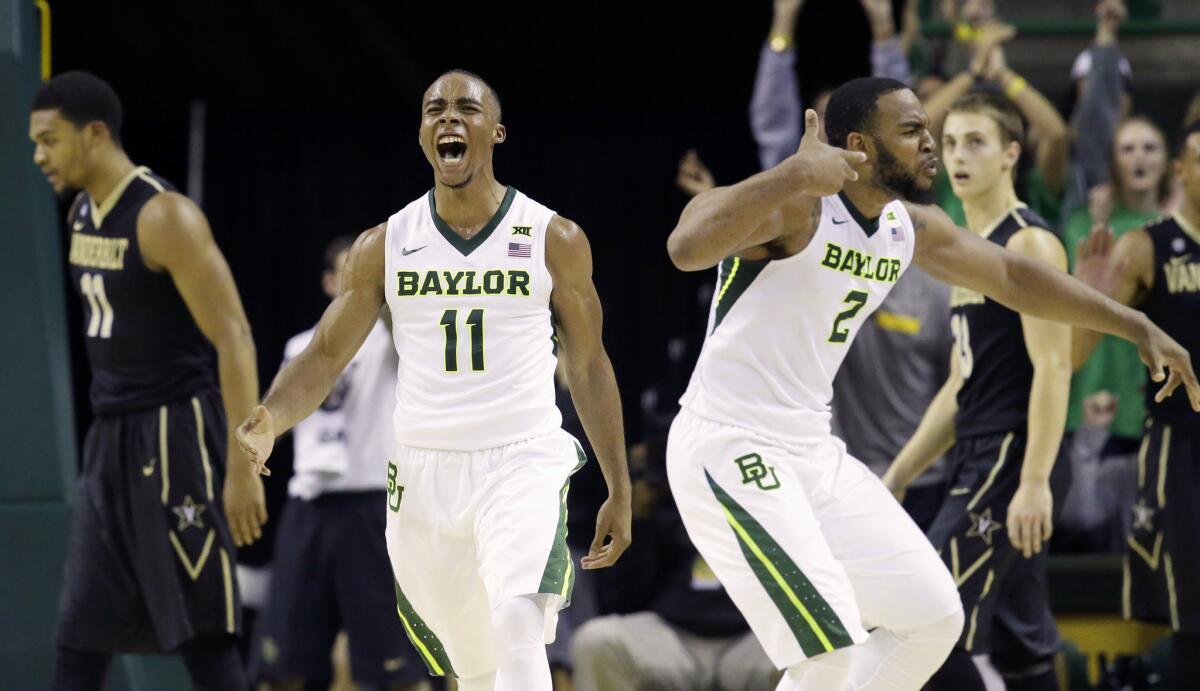 Baylor guard Lester Medford (11) and forward Rico Gathers (2) react after a second half basket against Vanderbilt.