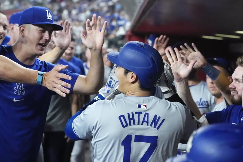 Los Angeles Dodgers designated hitter Shohei Ohtani, of Japan, celebrates his home run.