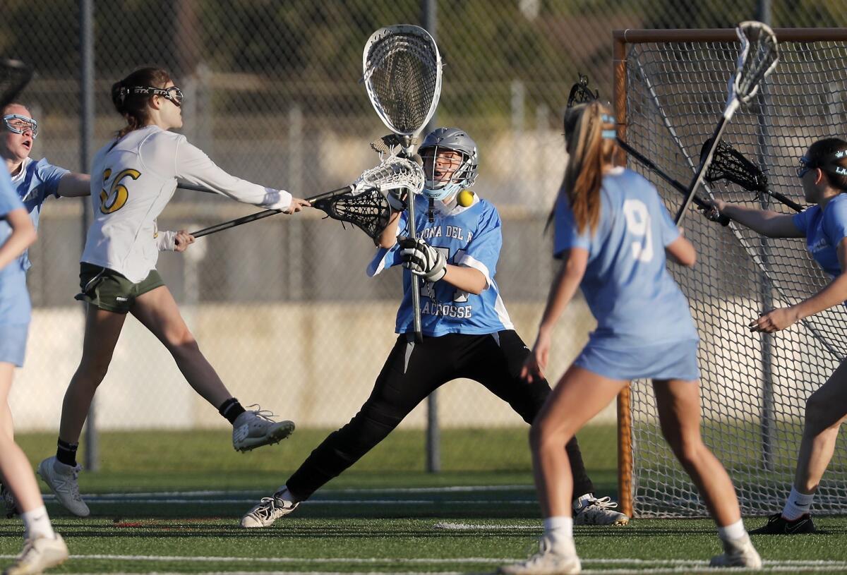 Corona del Mar High goalkeeper Katie Langley defends the net during the first half of a Sunset League game at Edison on Thursday.