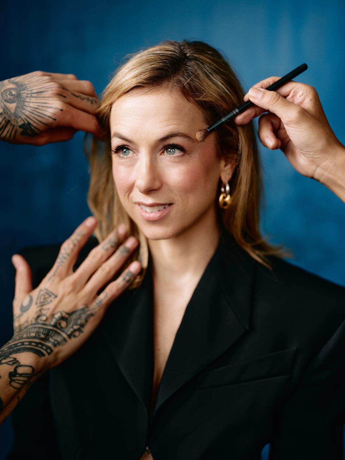 Portrait of comedian Iliza Shlesinger getting hairsbreadth and constitution done