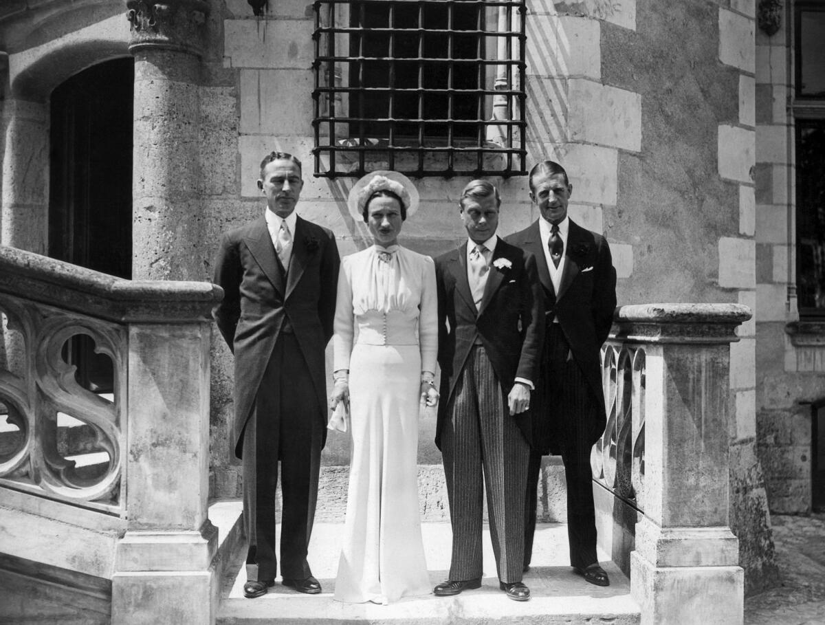 June 3, 1937: The Duke of Windsor, formerly King Edward VIII, and Wallis Simpson after their wedding at Cande Castle, France, with witnesses Hermann Rogers, left, and Major Metcalf.