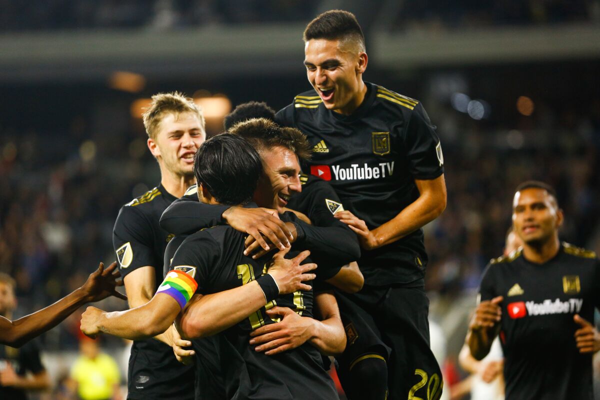LOS ANGELES, CALIF. - MAY 24: Los Angeles FC defender Tristan Blackmon (27) and teammates celebrate Blackmon's goal against the Montreal Impact during a Major League Soccer game between the Montreal Impact and the Los Angeles FC at Banc of California Stadium on Friday, May 24, 2019 in Los Angeles, Calif. (Kent Nishimura / Los Angeles Times)