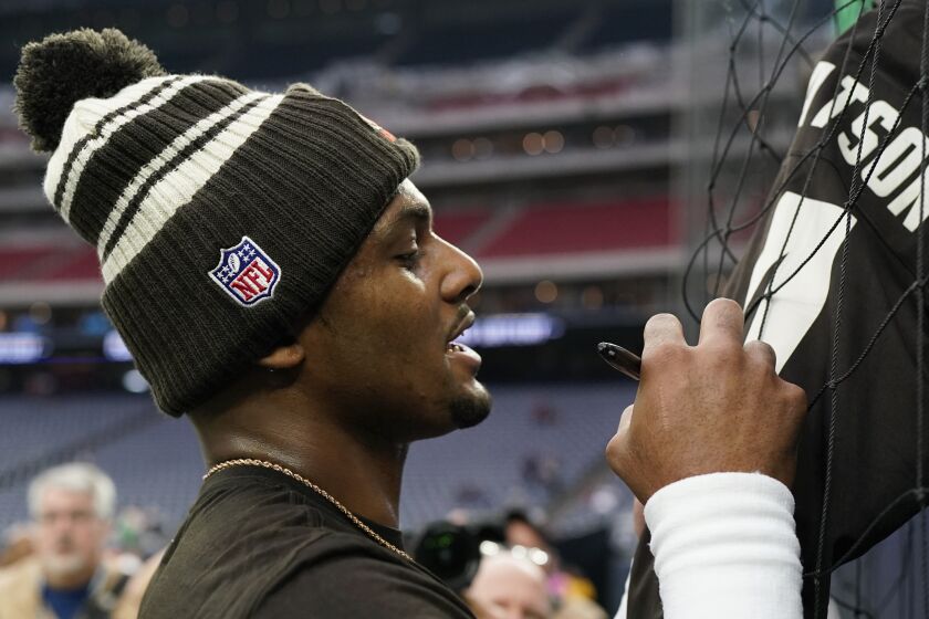 Cleveland Browns quarterback Deshaun Watson signs autographs before of an NFL football game between the Cleveland Browns and Houston Texans in Houston, Sunday, Dec. 4, 2022,. (AP Photo/Eric Gay)