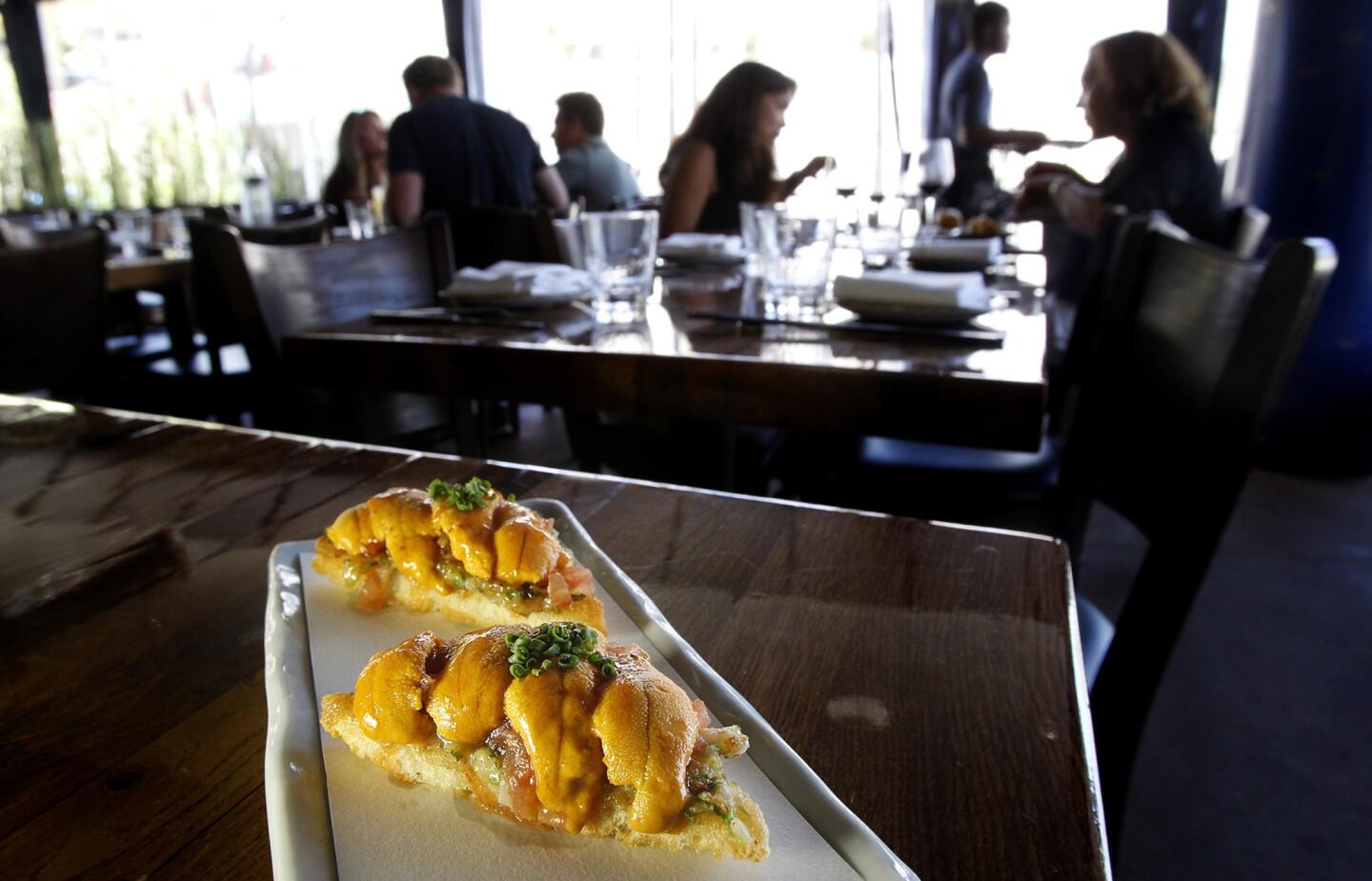 Uni shrimp toast made with sea urchin, shrimp paste and rocoto honey sauce is offered at Paiche in Marina Del Rey.