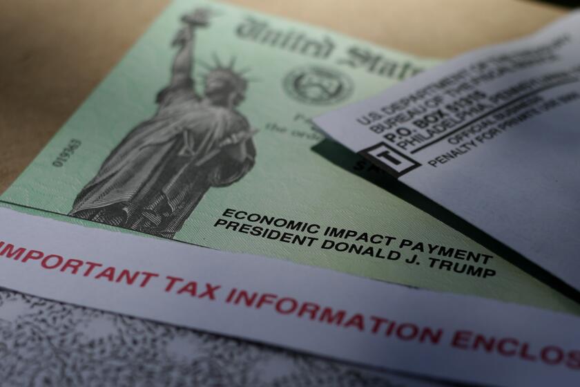 President Donald J.Trump's name is printed on a stimulus check issued by the IRS to help combat the adverse economic effects of the COVID-19 outbreak, Thursday, April 23, 2020, in San Antonio. According to the Treasury Department, it marks the first time a president's name has appeared on any IRS payments, whether refund checks or other stimulus checks that have been mailed during past economic crises. (AP Photo/Eric Gay)