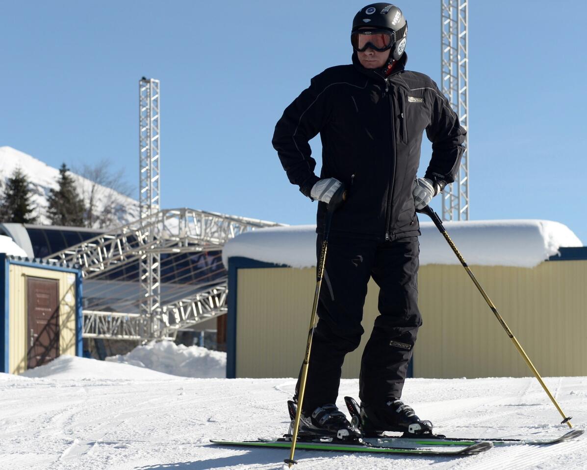 Russian President Vladimir Putin tests the alpine slope at Laura Stadium, designed to host cross-country skiing and biathlon events during the Winter Olympic Games in Sochi.