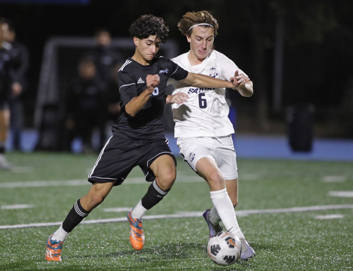 Corona Del Mar's Gavin Callum (16) and Newport Harbor's James Evans will battle for a loose ball in midfield on Monday.