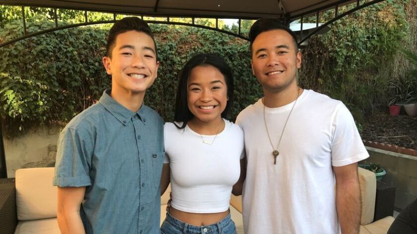 UC Irvine freshman Noah Domingo, 18, left, with his siblings