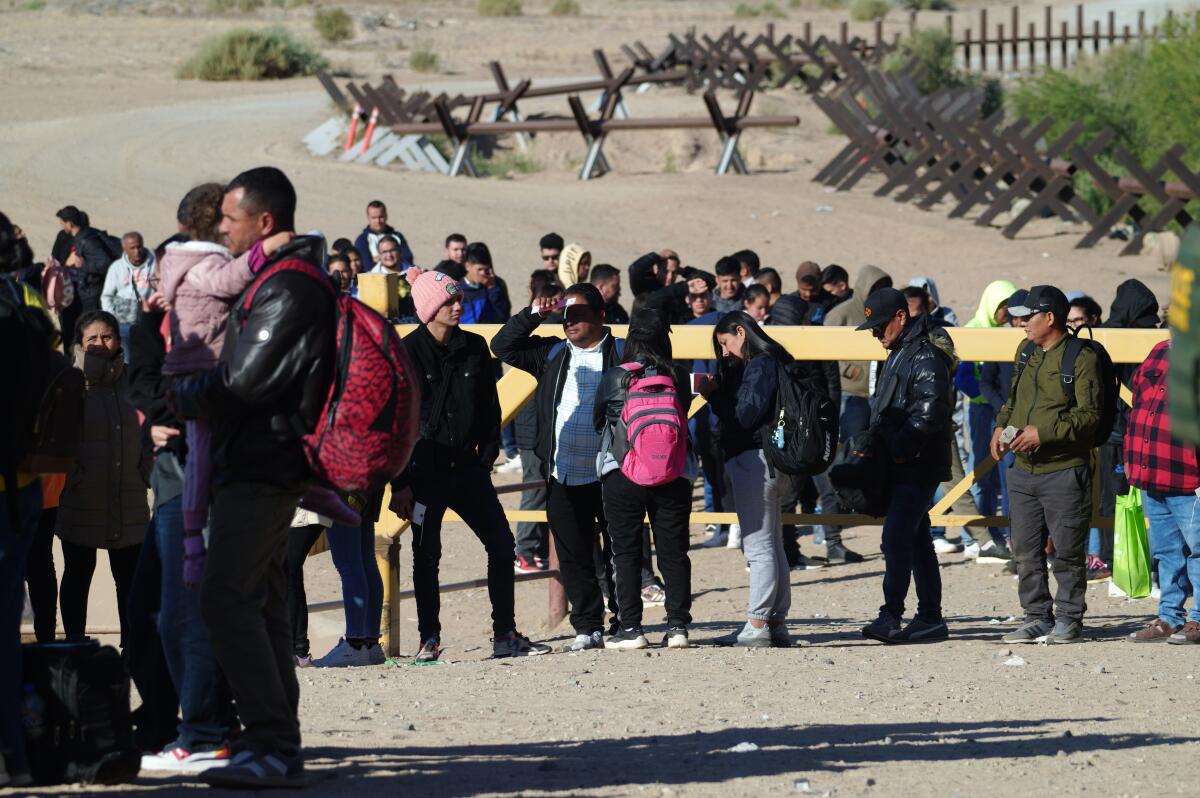 A line of people at a border