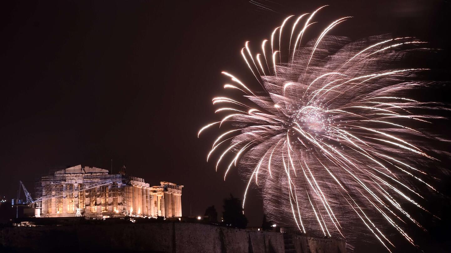 Fireworks explode near the Parthenon for New Year's celebrations in Athens.