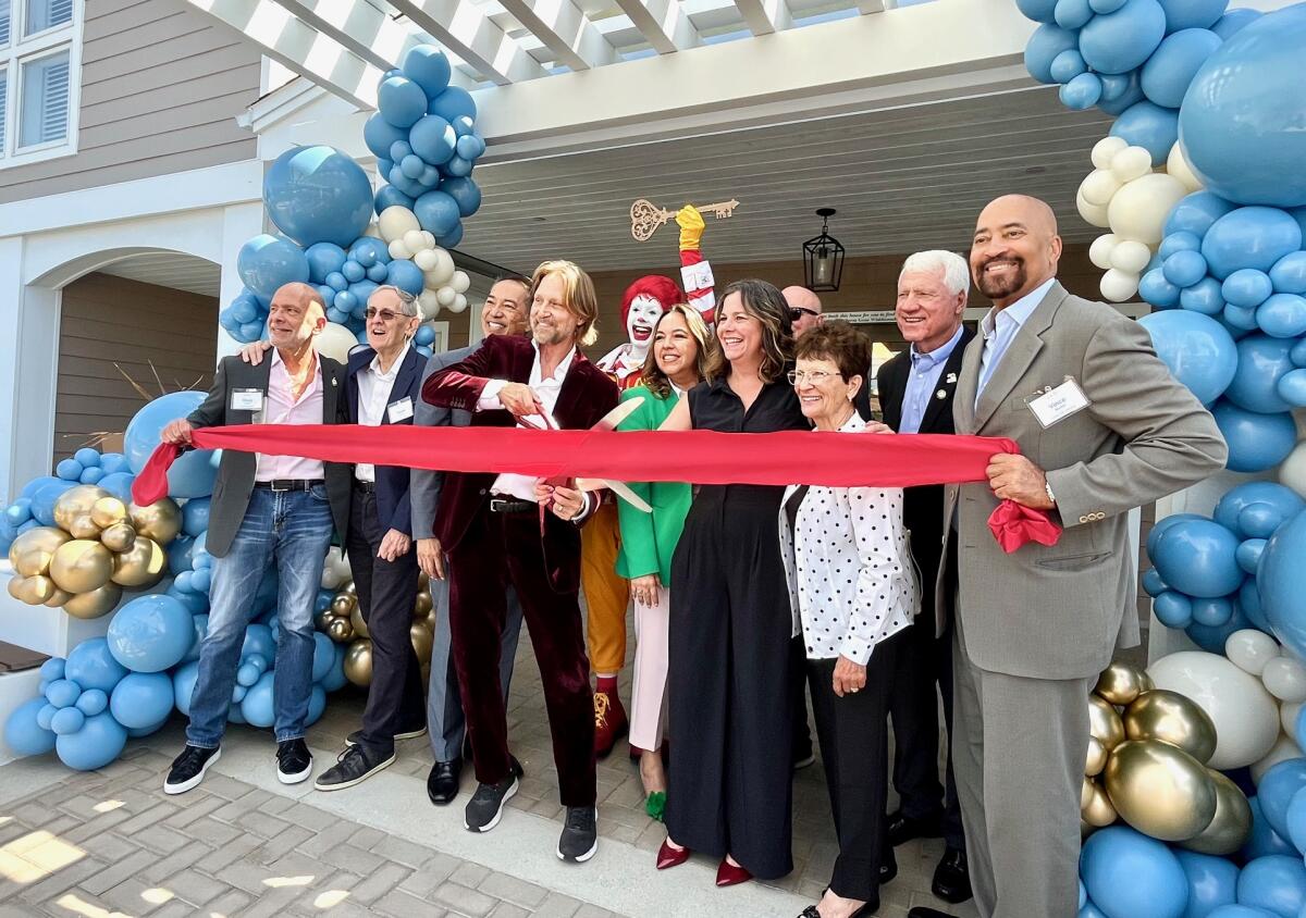 Charles Antis cuts the ribbon at Ronald McDonald House Orange County.