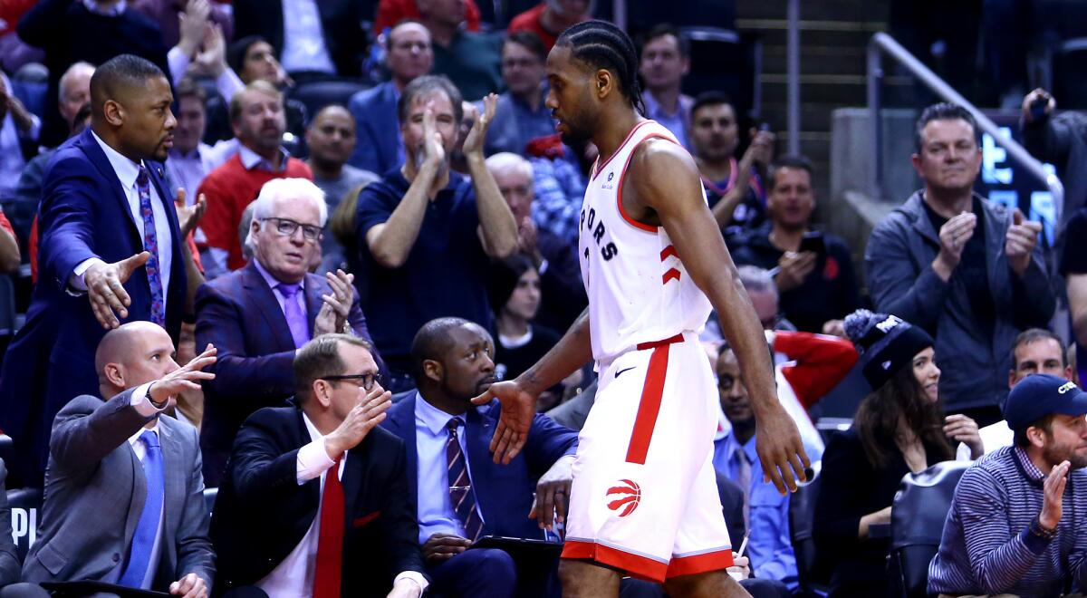 Raptor forward Kawhi Leonard leaves the court with a Game 2 win over the Magic in hand.