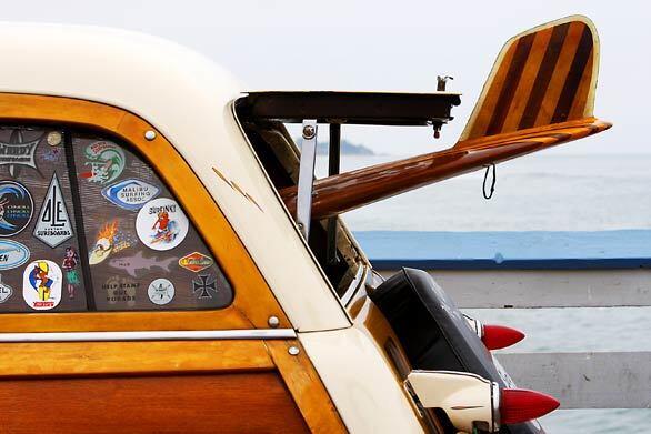 A 1951 Ford woodie owned by Mike Chase sits on display on the historic San Clemente pier.