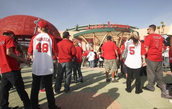 Fans make their way in Angel Stadium for the team's season opener against the Kansas City Royals on Friday.