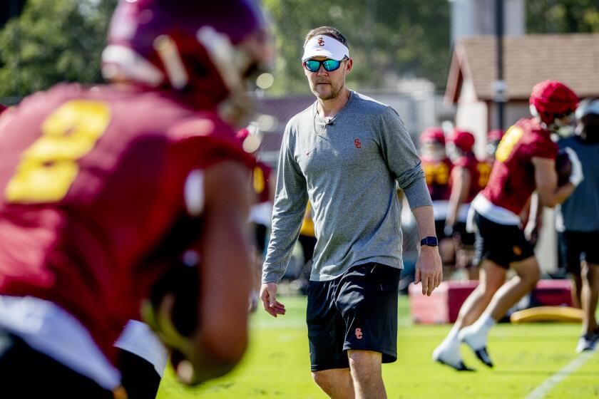 LOS ANGELES, CA - MARCH 22, 2022: First year USC football coach Lincoln Riley watches.