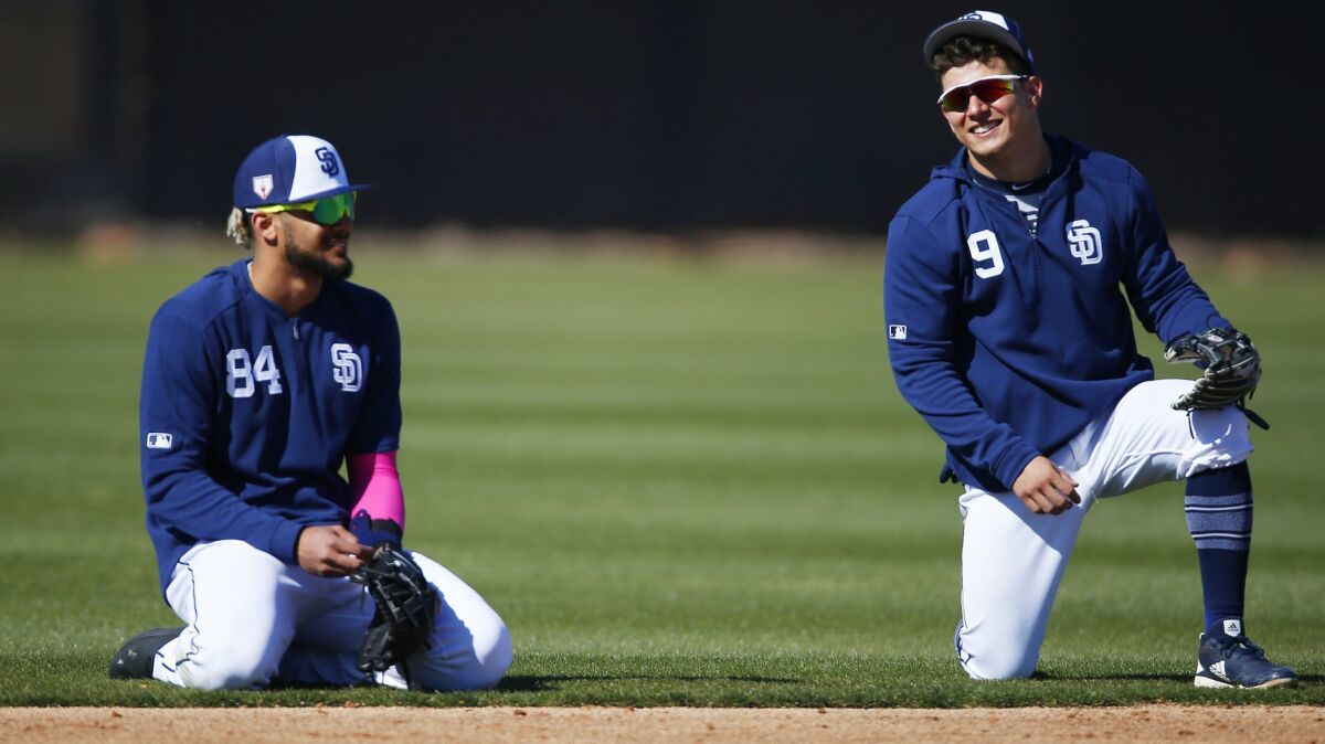 Fernando Tatis Jr., left, and Luis Urias, the Padres' top position prospects, start together for the first time Monday night.