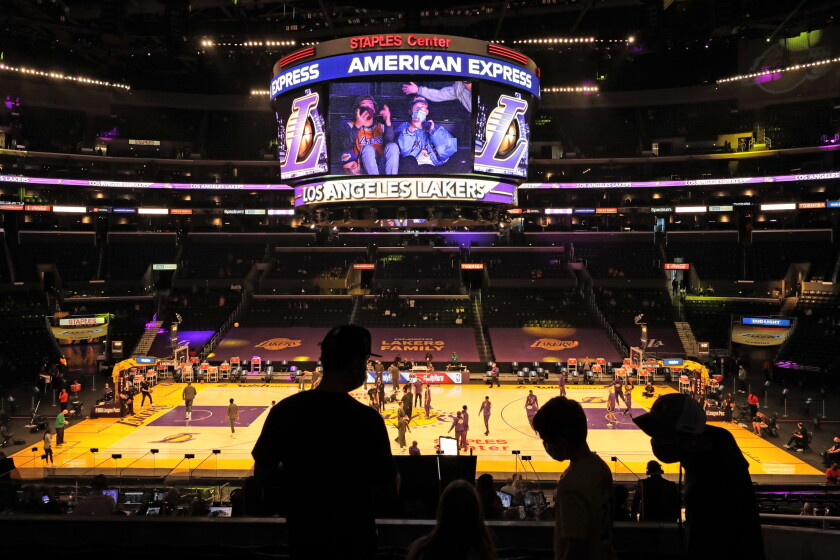 In troubling shift, Black residents now have highest risk
for COVID-19 in L.A. County 4 Fans take their seats before the Lakers take on the Boston Celtics at Staples Center on April 15, 2021.