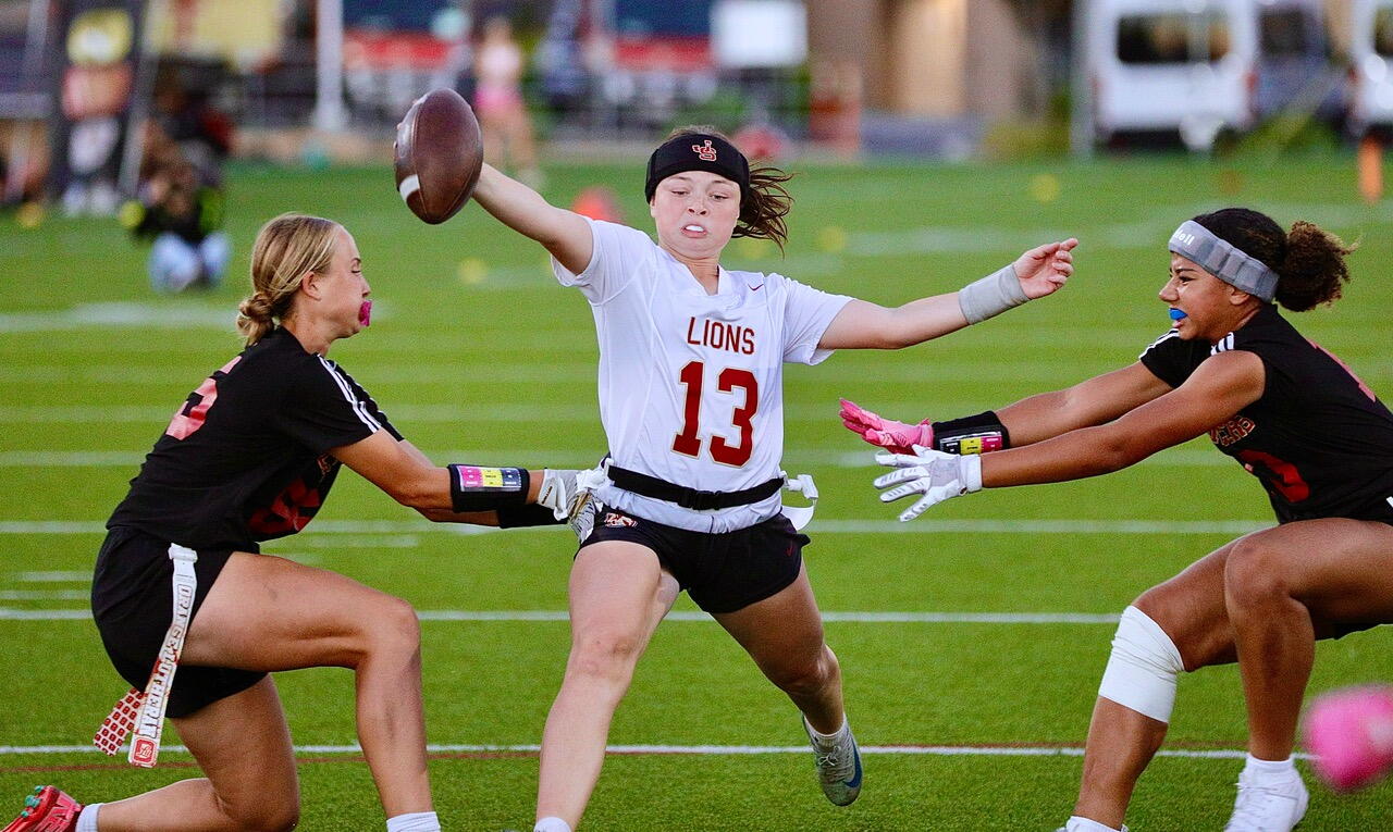 JSerra quarterback Kate Meier reaches across the goal line.