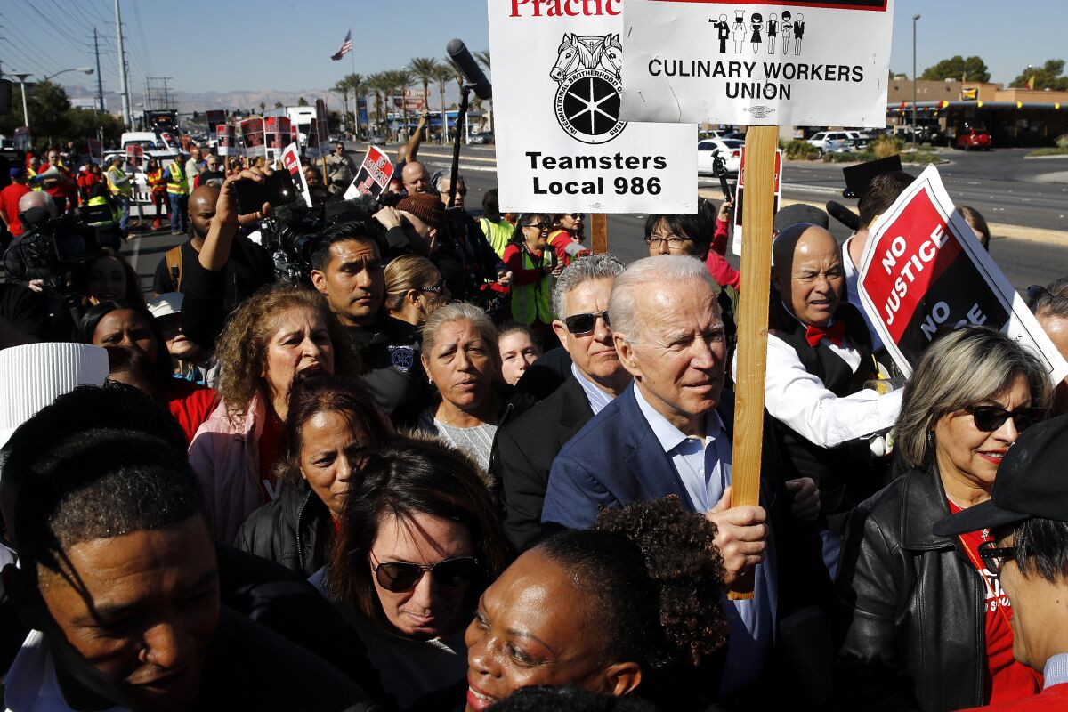 Joe Biden walks on a picket line with members of the Culinary Workers Union Local 226 