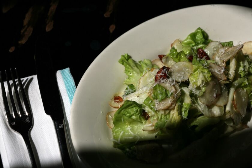 Escarole and sunchoke salad with preserved lemon and smoked almonds. Get the recipe.