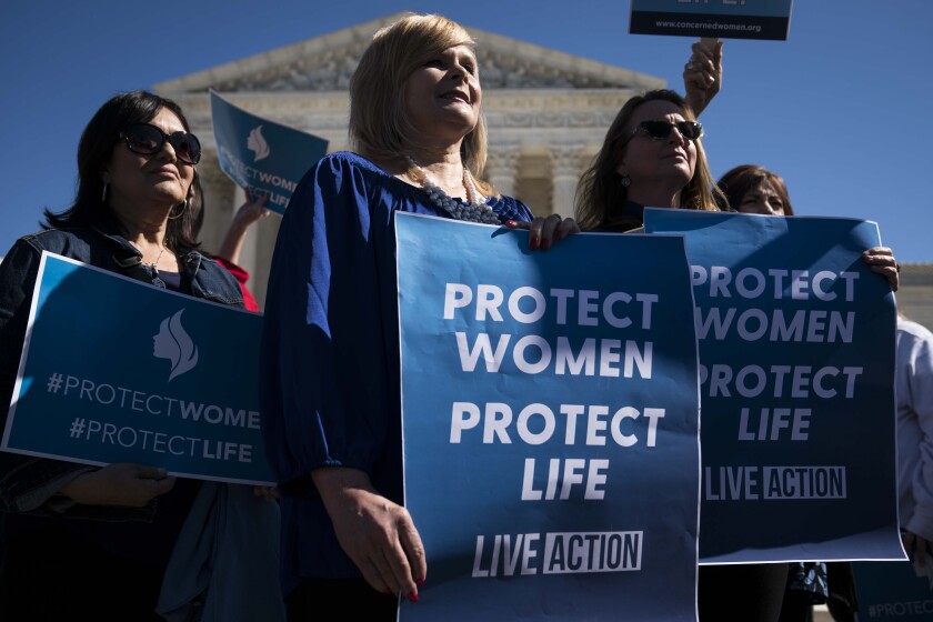 Abortion opponents participate in a rally outside the Supreme Court building in March.
