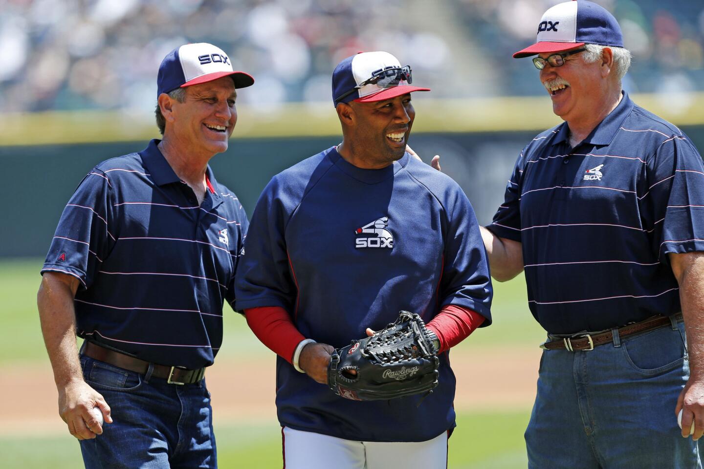 Former White Sox players Floyd Bannister, White Sox assistant hitting coach Harold Baines and Dennis Lamp chat before a game at U.S. Cellular Field on June 30, 2013.