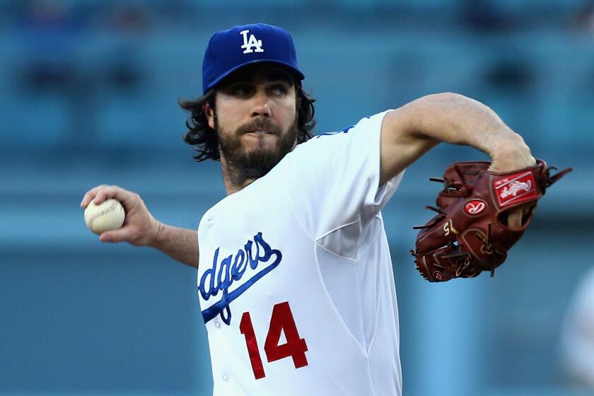 Dodgers starter Dan Haren delivers a pitch during the first inning of the team's 8-2 loss to the Chicago Cubs at Dodger Stadium on Friday.