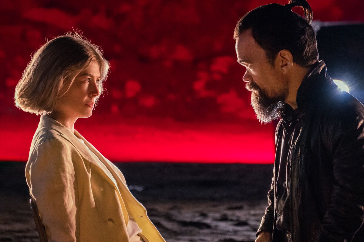 Rosamund Pike as Marla and Peter Dinklage as Roman in 'I Care A Lot' on Netflix. 