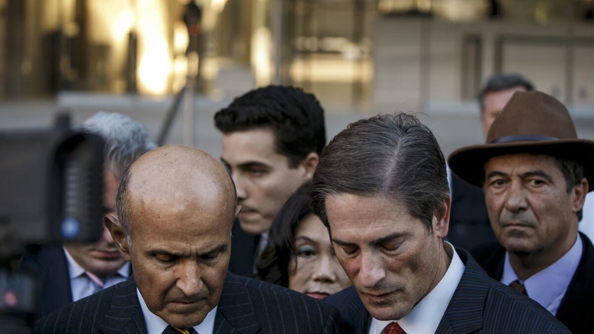 Former Los Angeles County Sheriff Lee Baca left with attorney Nathan Hochman outside federal court Thursday, in downtown Los Angeles.