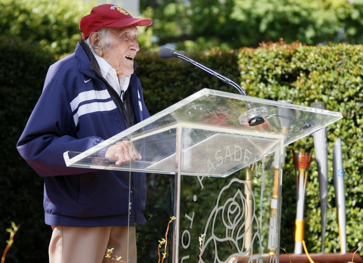 American war hero, World War II prisoner of war and olympian Louis Zamperini, center, was chosen as the Grand Marshal for the 2015 tournament of Roses, in Pasadena on Friday, May 9, 2014.